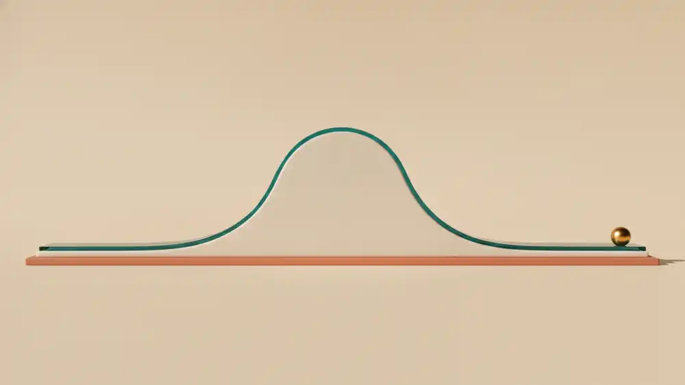 A clay bell curve sculpture with a small gold sphere resting at the far end of its long right tail